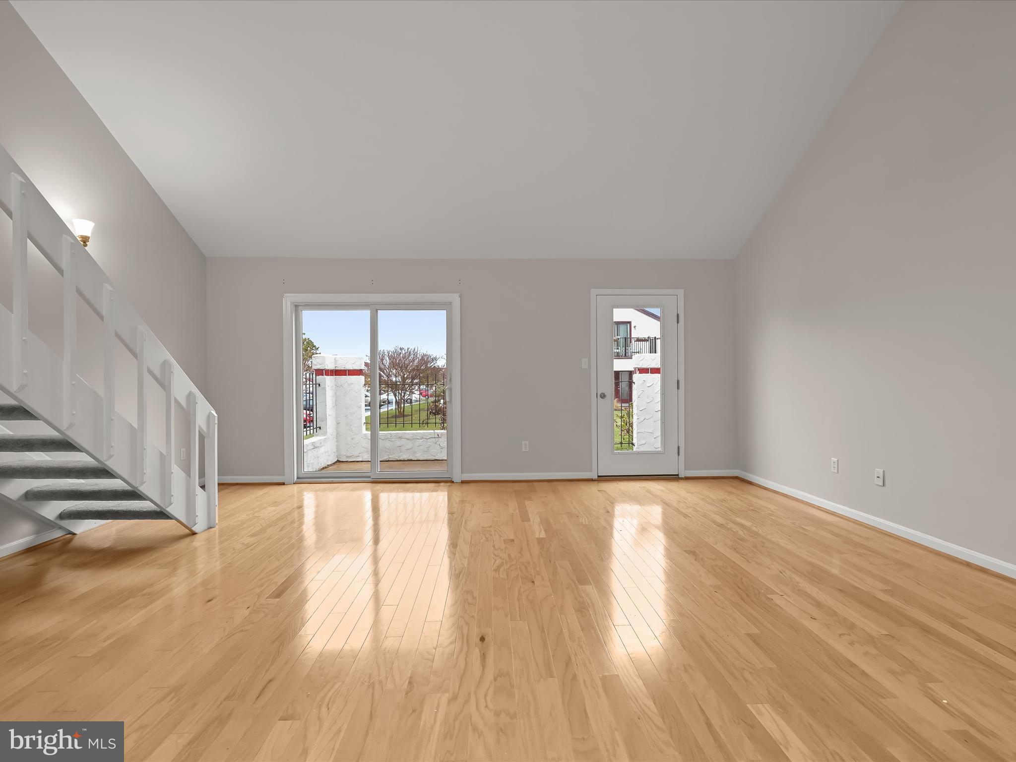 2 Queen Victoria Way Chester, MD 21619 - Photo 11 of 53 a view of an empty room with wooden floor and fan