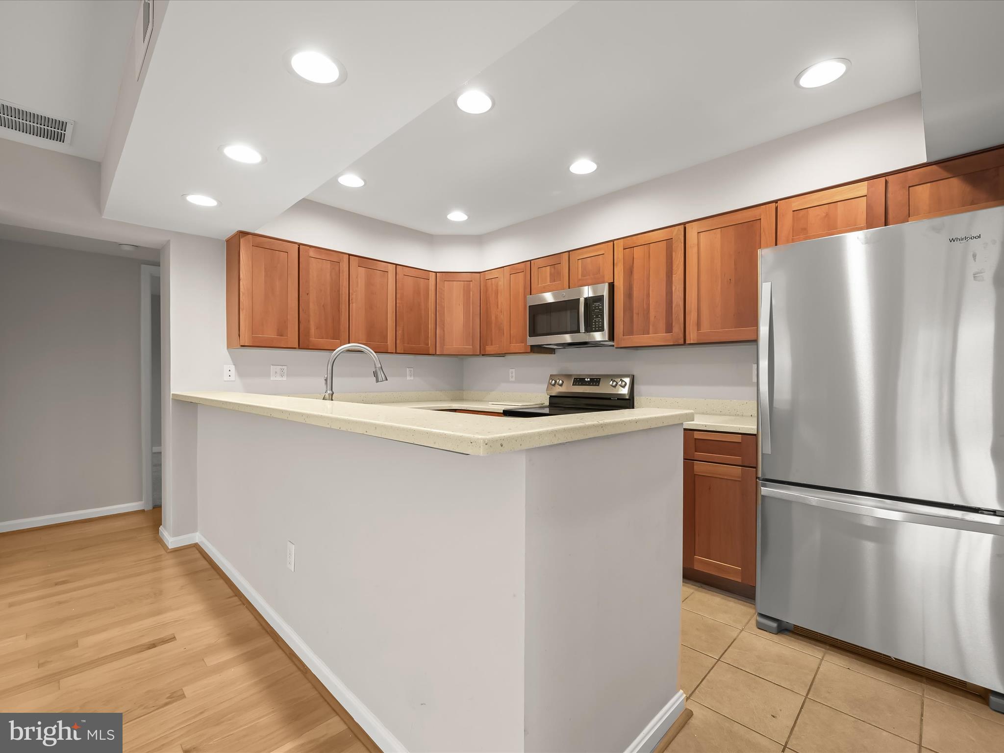 2 Queen Victoria Way Chester, MD 21619 - Photo 16 of 53 a kitchen with stainless steel appliances granite countertop a refrigerator a sink and a stove
