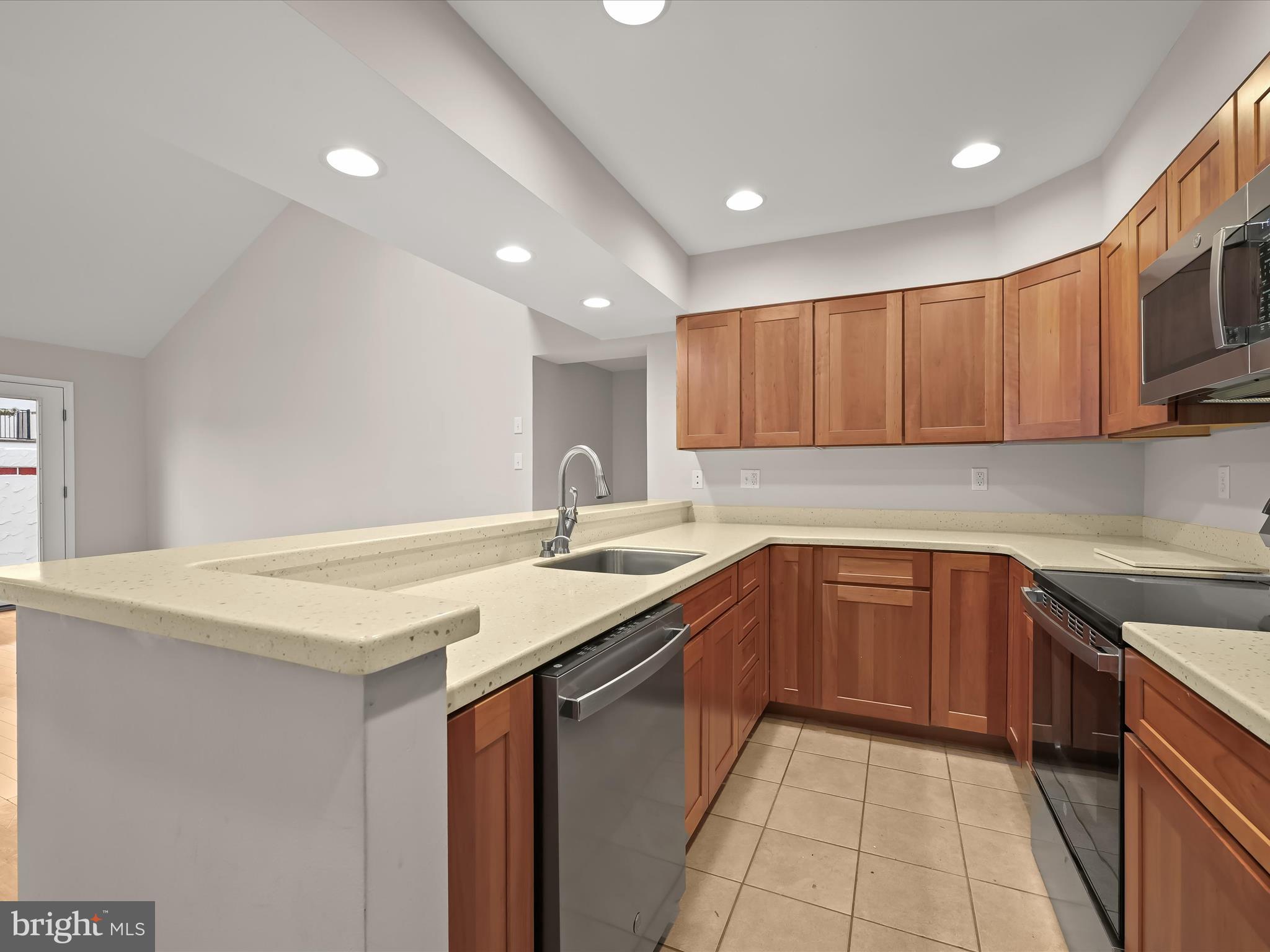 2 Queen Victoria Way Chester, MD 21619 - Photo 17 of 53 a kitchen with a sink and cabinets