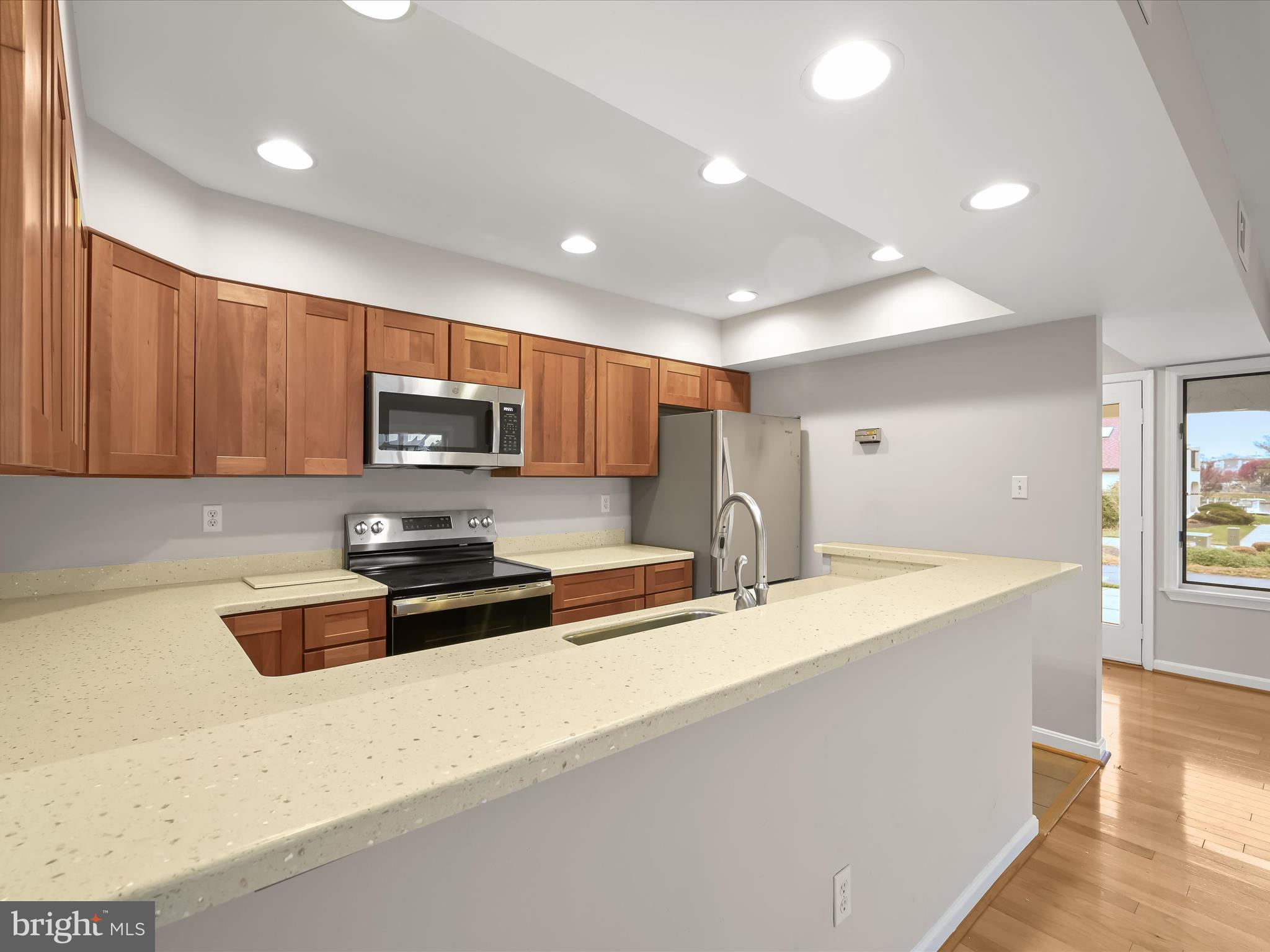 2 Queen Victoria Way Chester, MD 21619 - Photo 21 of 53 a kitchen with granite countertop a stove and a sink