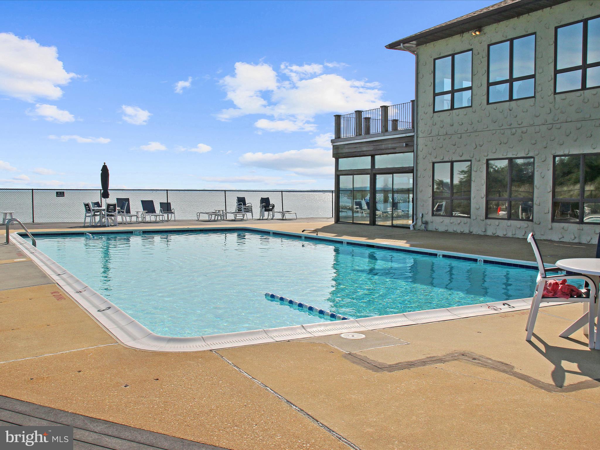 2 Queen Victoria Way Chester, MD 21619 - Photo 47 of 53 a view of a swimming pool with a lounge chairs