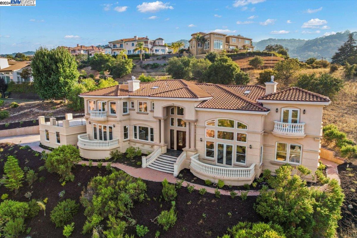 7175 Glenview Drive San Jose, CA 95120 - Photo 1 of 1 a front view of a residential apartment building with a yard