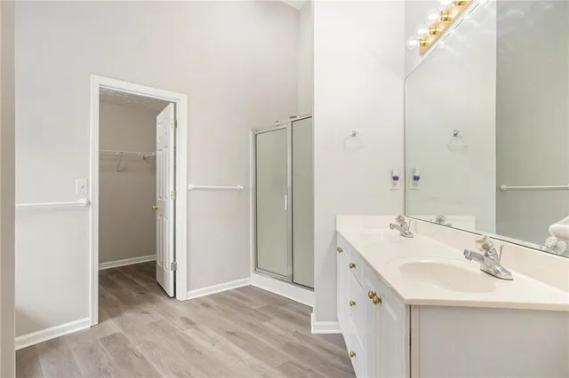 a bathroom with a double vanity sink and mirror
