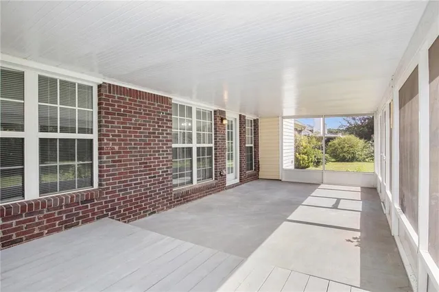 a view of backyard with large windows