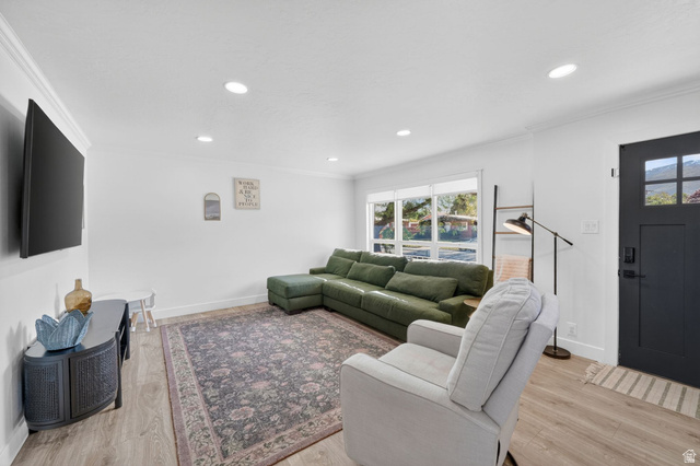 66 South 425 West Bountiful, UT 84010 - Photo 6 of 25 Bright living area featuring recessed lighting and crown molding