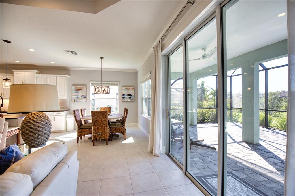 Undisclosed Address Venice, FL 34293 - Photo 15 of 45 a living room with furniture and a large window