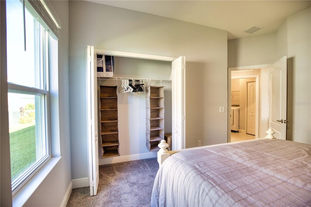 Undisclosed Address Venice, FL 34293 - Photo 24 of 45 a bedroom with a bed and a window