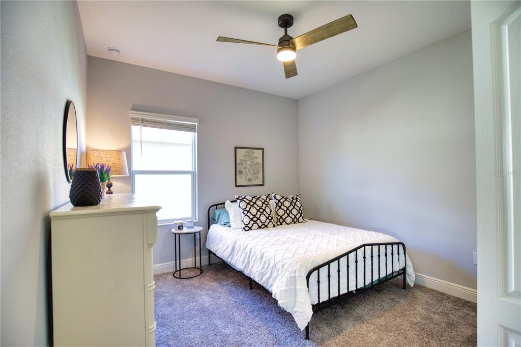 Undisclosed Address Venice, FL 34293 - Photo 26 of 45 a bedroom with a bed and window