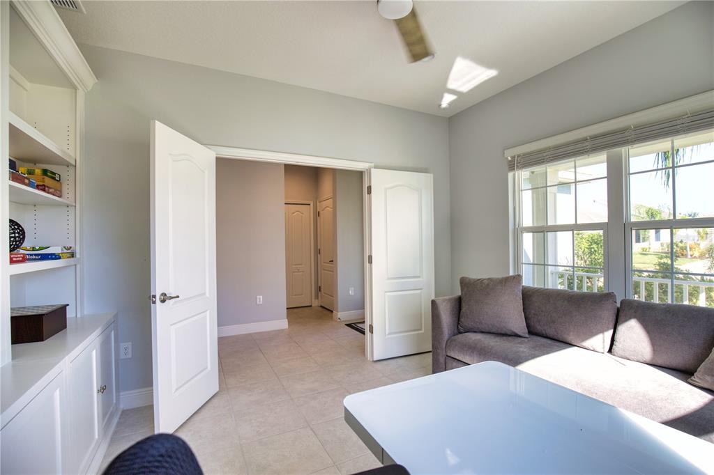 Undisclosed Address Venice, FL 34293 - Photo 29 of 45 a living room with furniture and a window