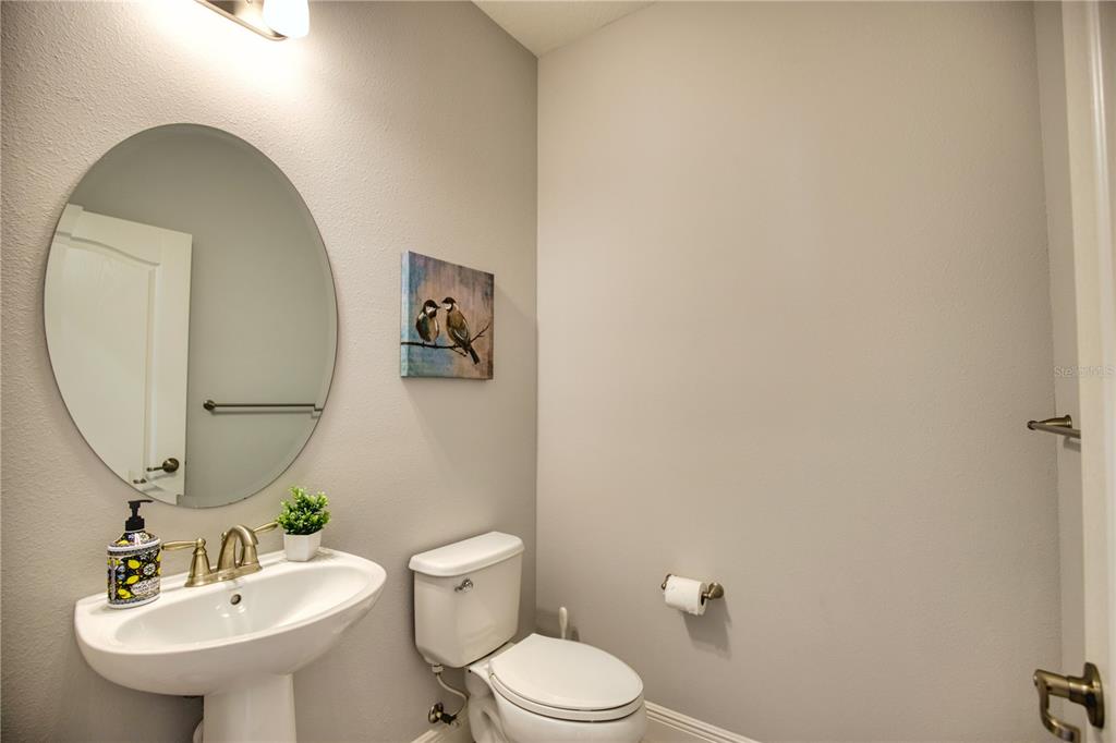 Undisclosed Address Venice, FL 34293 - Photo 30 of 45 a bathroom with a toilet a sink and mirror