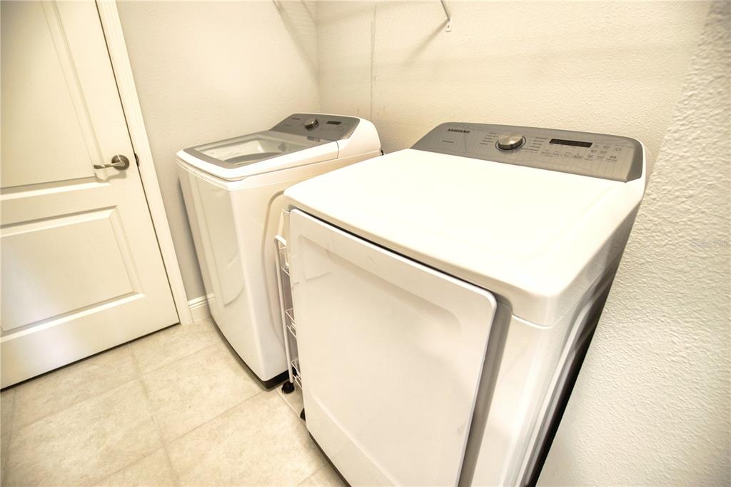 Undisclosed Address Venice, FL 34293 - Photo 31 of 45 a utility room with dryer and washer