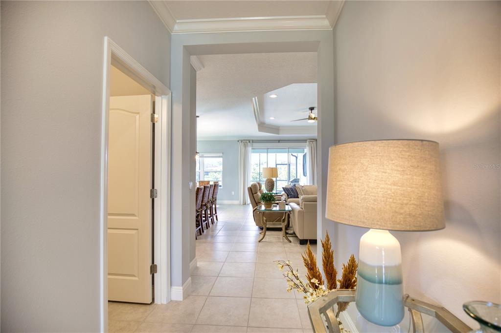 Undisclosed Address Venice, FL 34293 - Photo 6 of 45 a lobby with furniture and a mirror