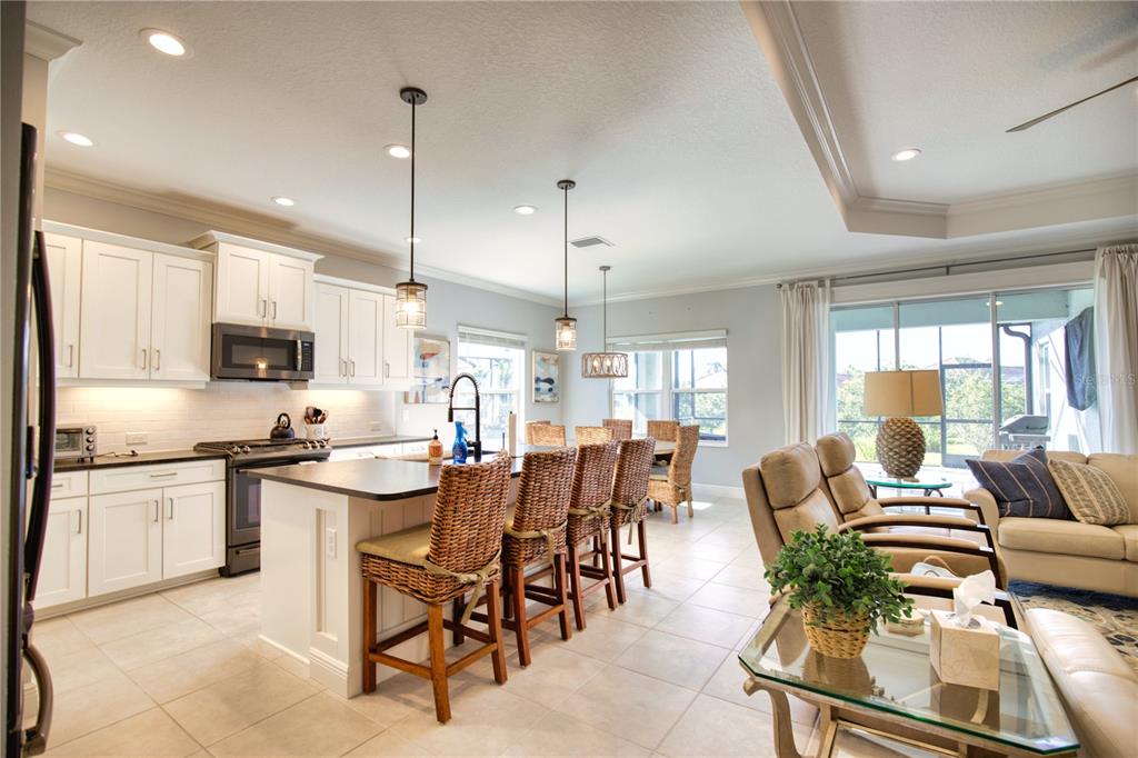 Undisclosed Address Venice, FL 34293 - Photo 7 of 45 a large kitchen with a table and chairs