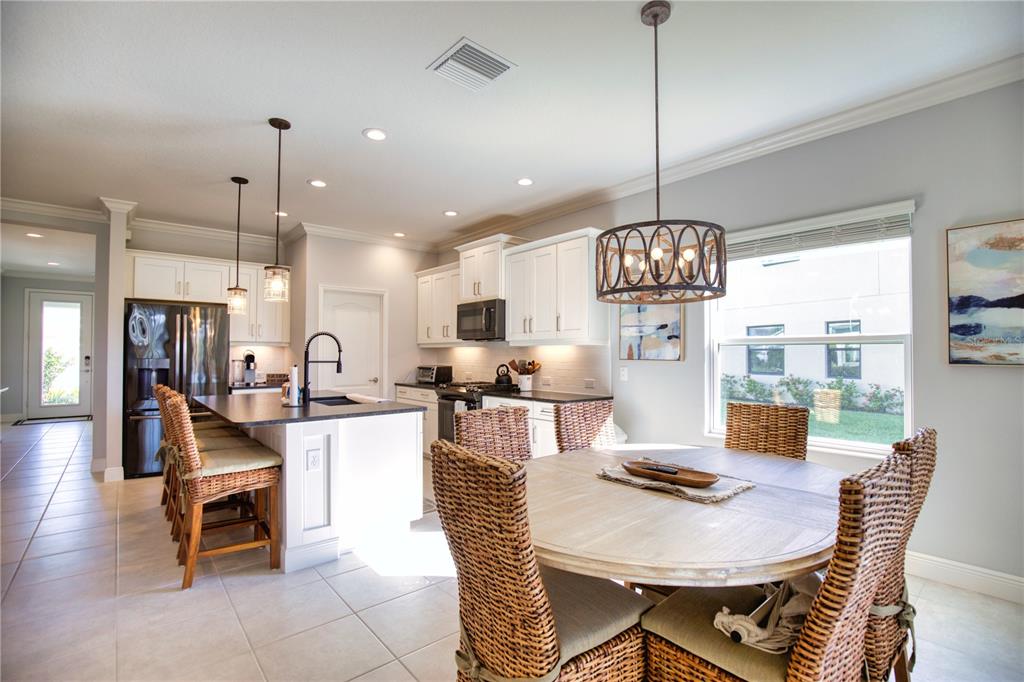 Undisclosed Address Venice, FL 34293 - Photo 8 of 45 a view of a dining room with furniture