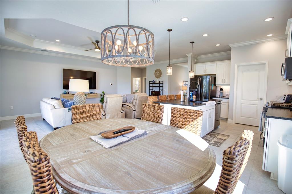 Undisclosed Address Venice, FL 34293 - Photo 9 of 45 a large kitchen with a table and chairs