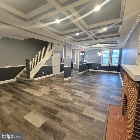 a view of a studio with wooden floor
