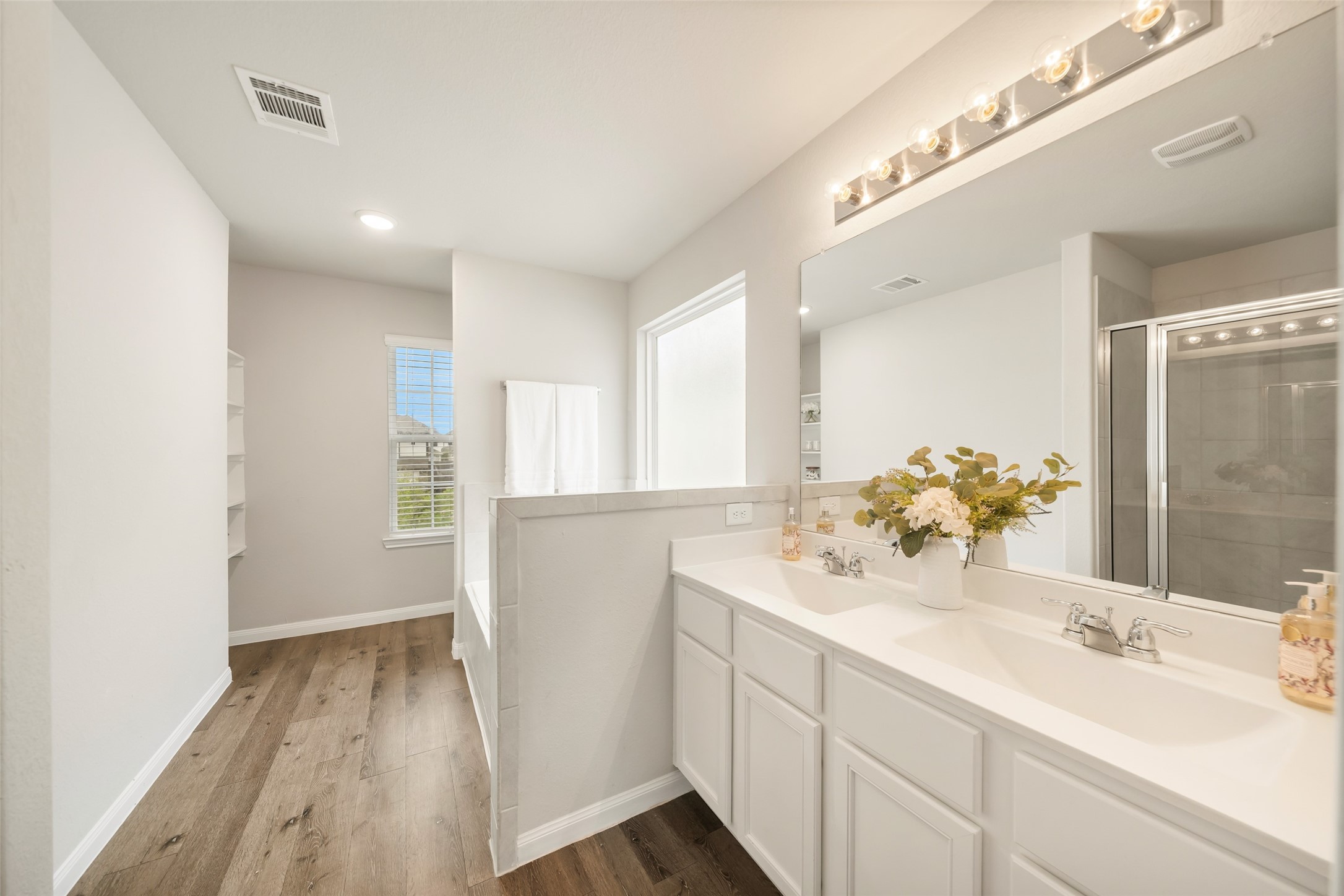 3628 Cub Drive Conroe, TX 77301 - Photo 20 of 32 Primary bathroom features a dual sink vanity...