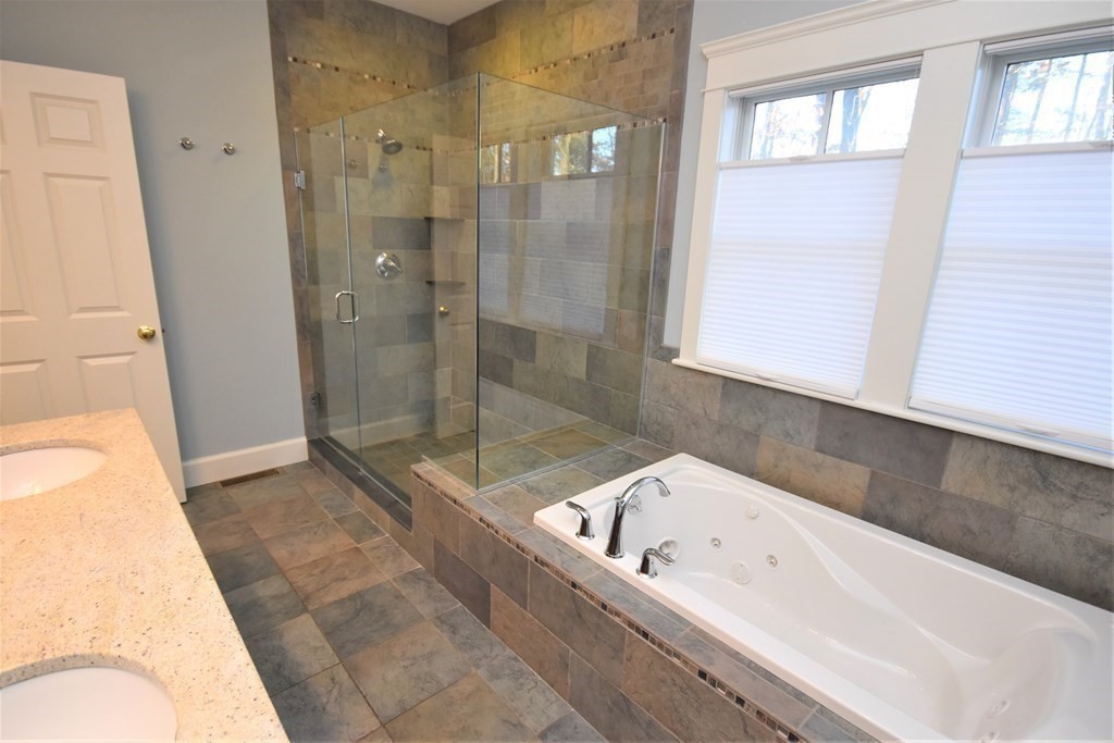 57 Linden Ridge Road Amherst, MA 01002 - Photo 23 of 42 a bathroom with a bathtub and shower