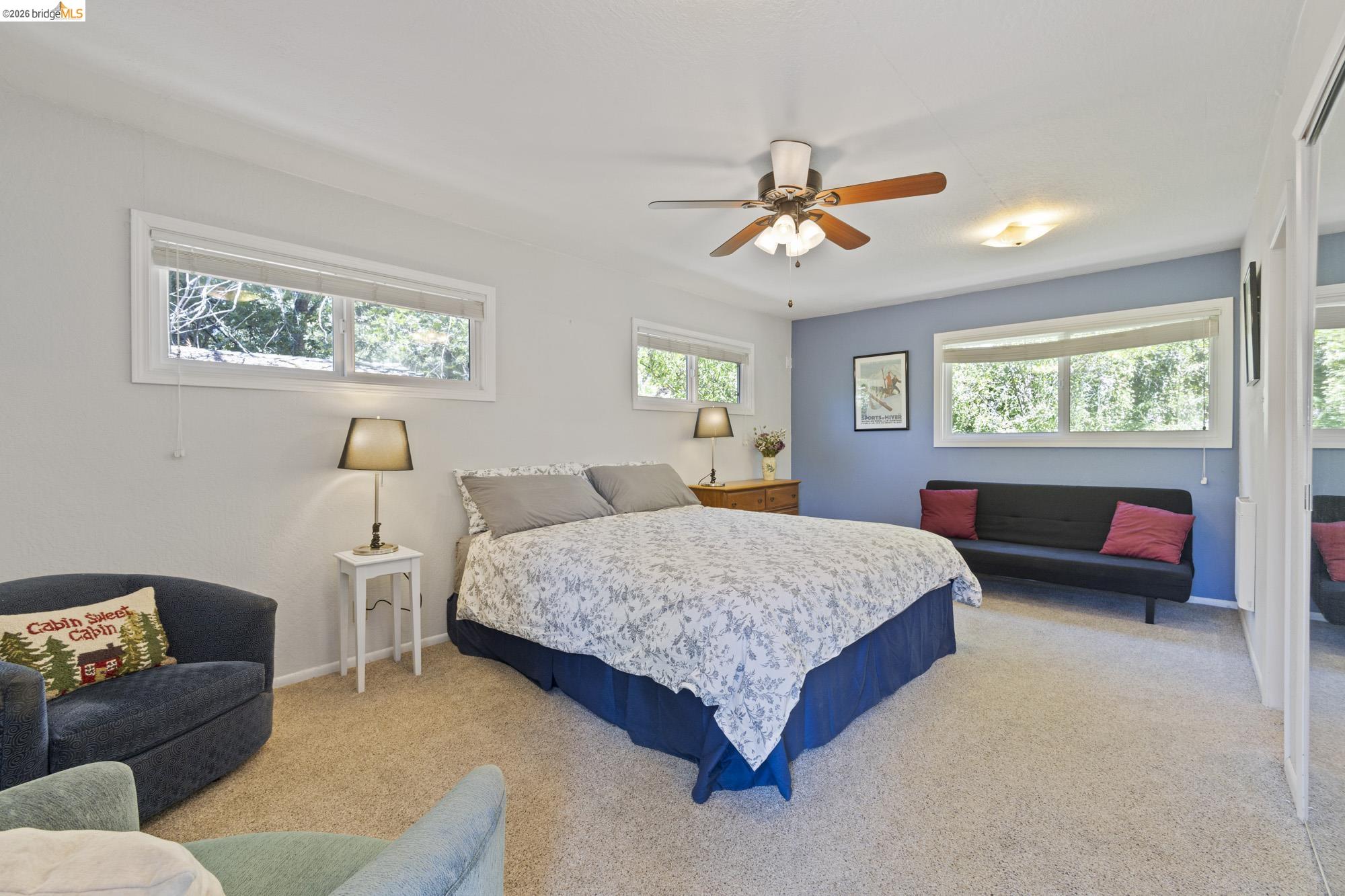 21815 Confidence Road Twain Harte, CA 95383 - Photo 19 of 30 a bed room with a bed window and couch