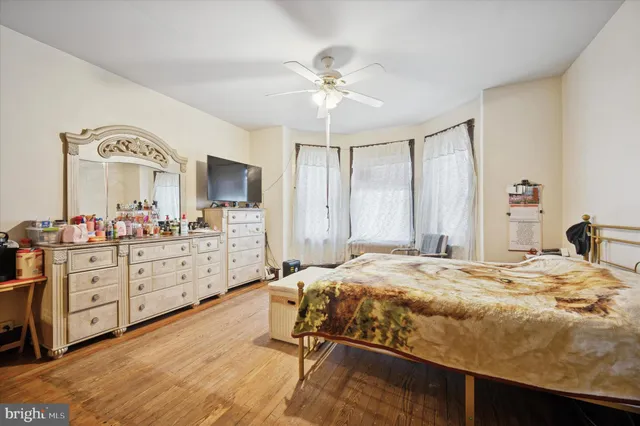 a bedroom with a bed and a dresser