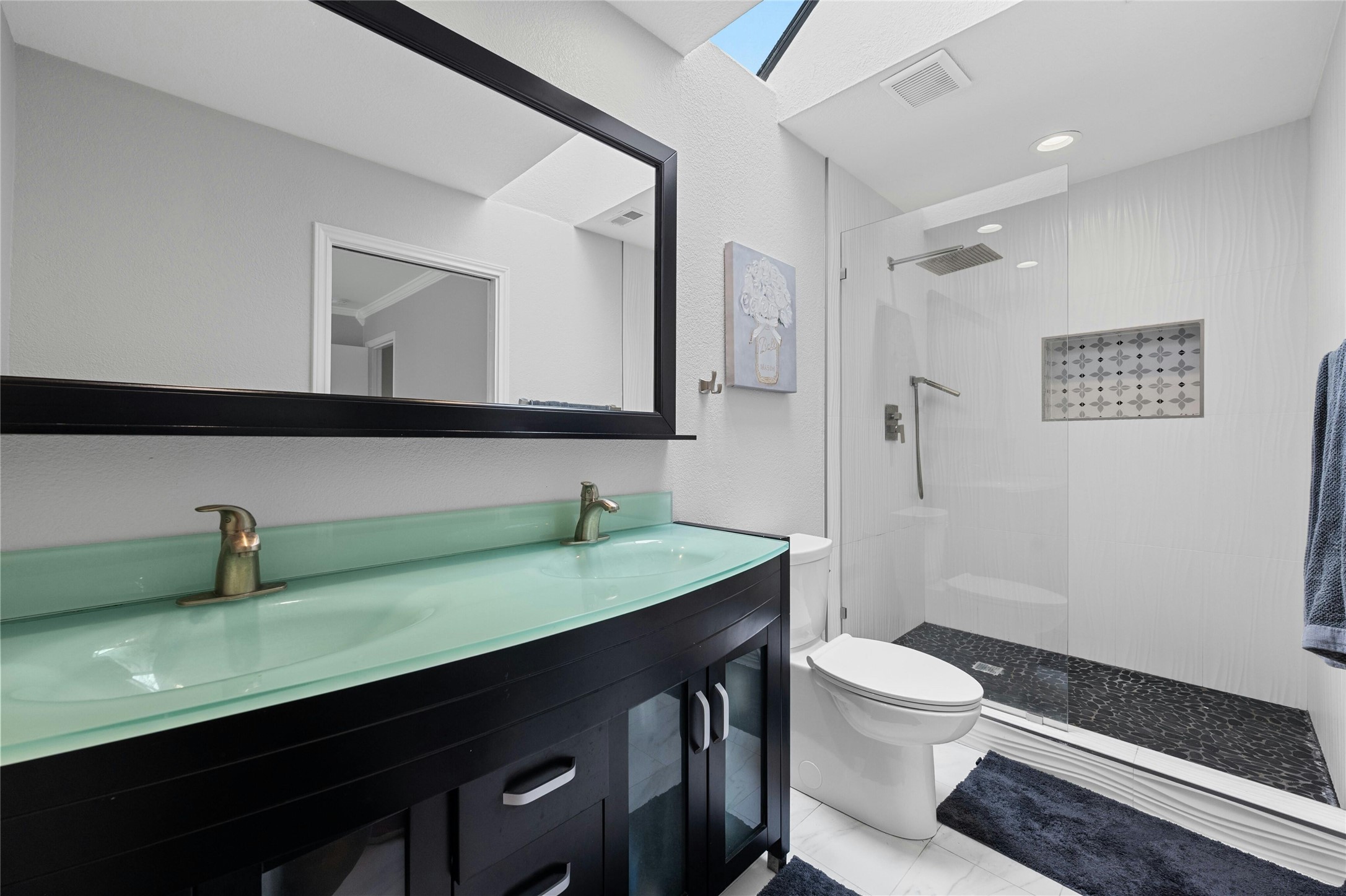 8303 Los Ranchos Drive Austin, TX 78749 - Photo 15 of 26 Bathroom featuring double vanity and walk in shower