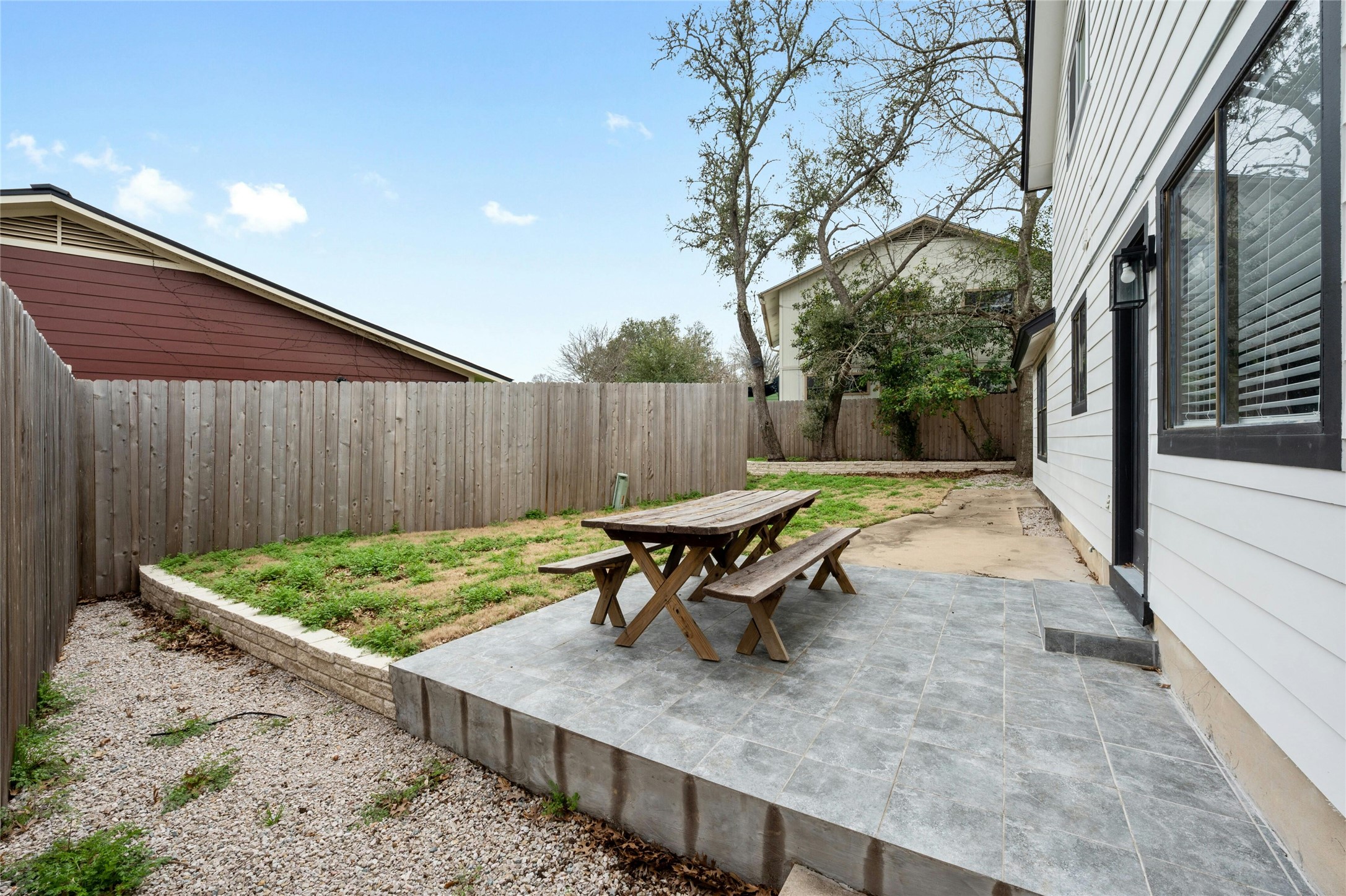8303 Los Ranchos Drive Austin, TX 78749 - Photo 22 of 26 Fenced backyard featuring a patio area and outdoor dining space