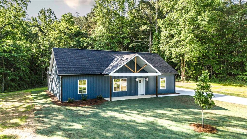 128 Pollard Road Temple, GA 30179 - Photo 2 of 36 a front view of a house with a garden