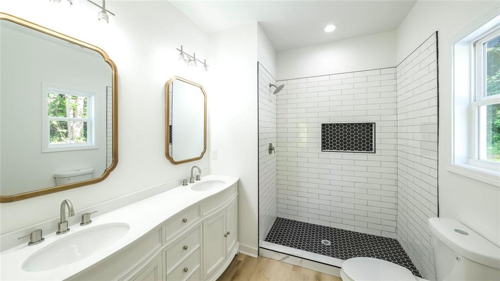 128 Pollard Road Temple, GA 30179 - Photo 22 of 36 a bathroom with a sink a toilet and shower