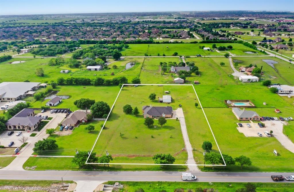 1425 Avondale Haslet Road Fort Worth, TX 76052 - Photo 4 of 10 an aerial view of a pool yard and outdoor seating
