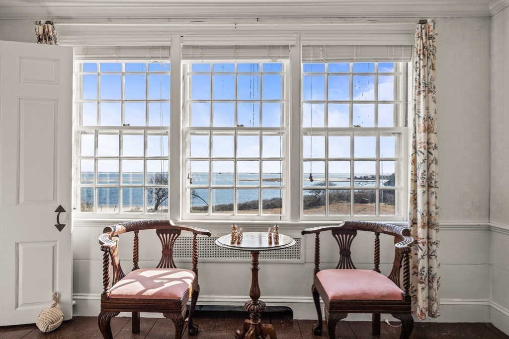 504 Old Harbor Road Chatham, MA 02633 - Photo 11 of 42 a living room with furniture and a window