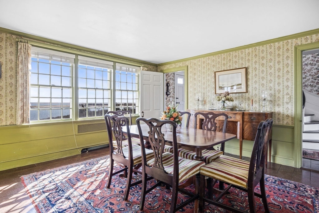 504 Old Harbor Road Chatham, MA 02633 - Photo 12 of 42 a view of a dining room with furniture window and outside view