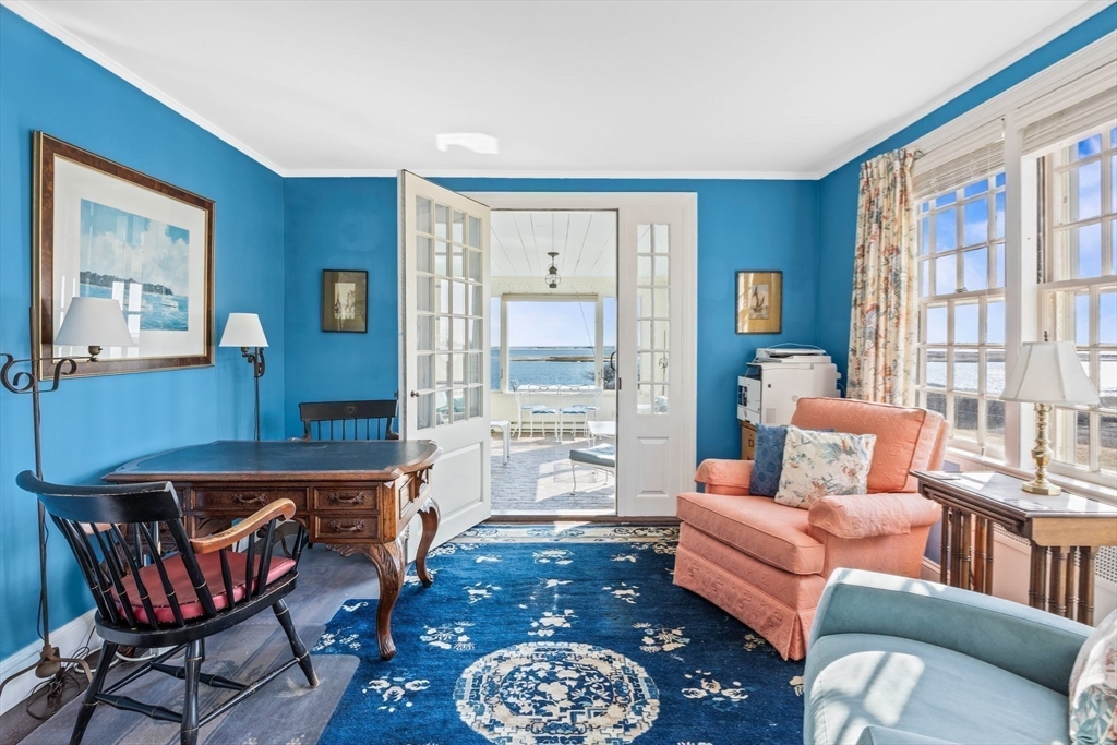 504 Old Harbor Road Chatham, MA 02633 - Photo 14 of 42 a living room with furniture a rug and a large window