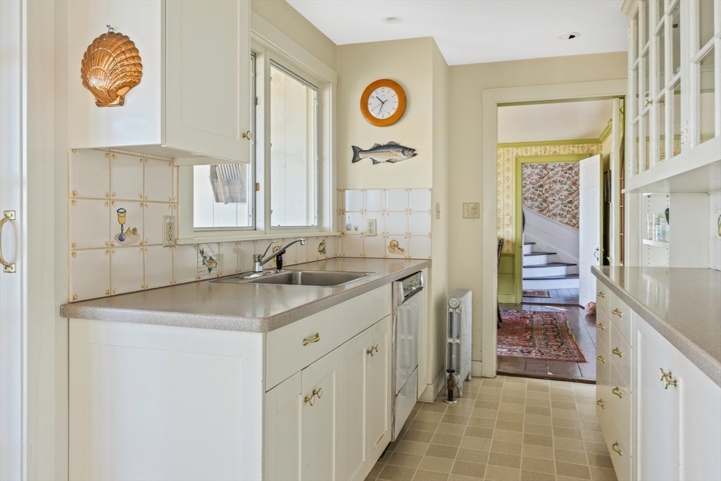 504 Old Harbor Road Chatham, MA 02633 - Photo 19 of 42 a bathroom with a sink a mirror and a shower