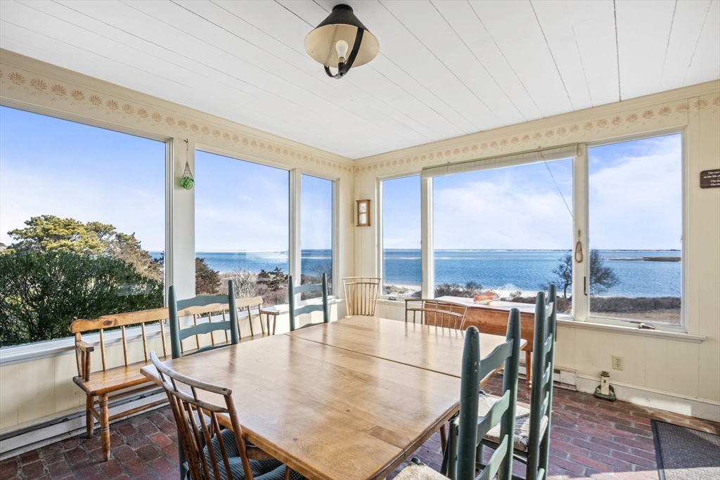 504 Old Harbor Road Chatham, MA 02633 - Photo 21 of 42 a view of a dining room with furniture window and outside view