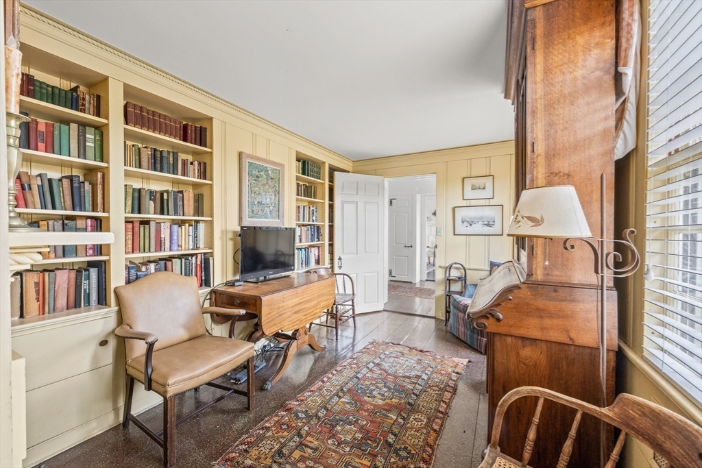 504 Old Harbor Road Chatham, MA 02633 - Photo 23 of 42 a living room with furniture and a floor to ceiling window