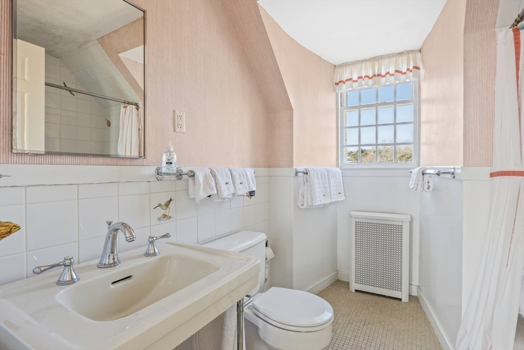 504 Old Harbor Road Chatham, MA 02633 - Photo 30 of 42 a bathroom with a sink toilet and shower