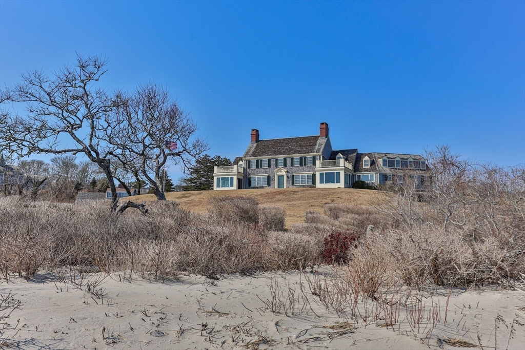 504 Old Harbor Road Chatham, MA 02633 - Photo 34 of 42 a front view of a house with a yard