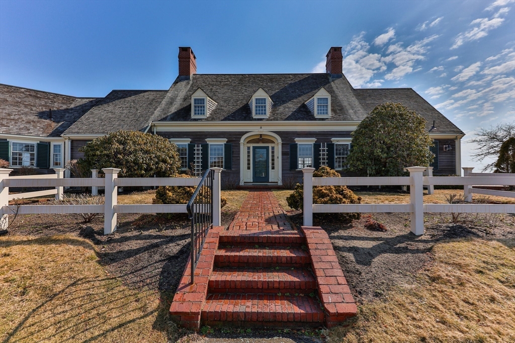 504 Old Harbor Road Chatham, MA 02633 - Photo 5 of 42 a front view of a house with a yard