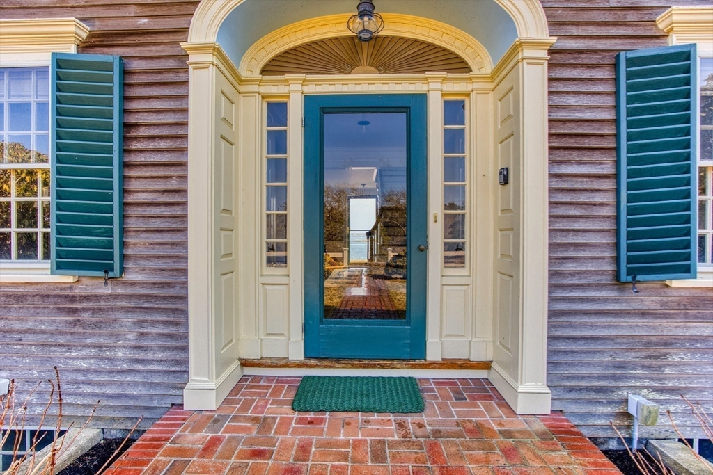 504 Old Harbor Road Chatham, MA 02633 - Photo 6 of 42 a view of a entryway door of the house