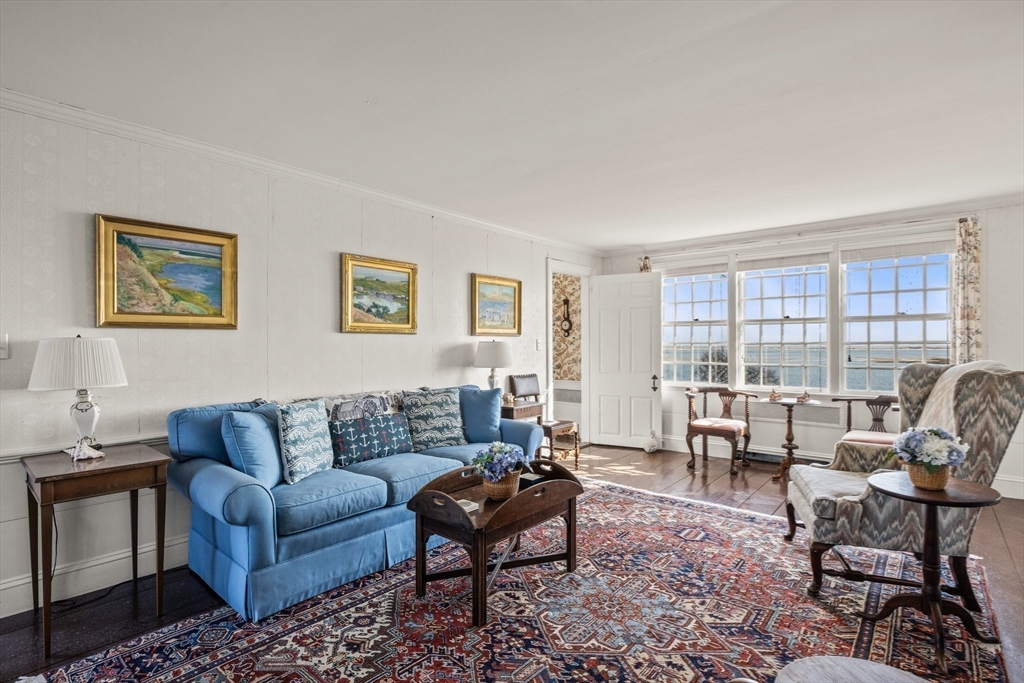 504 Old Harbor Road Chatham, MA 02633 - Photo 10 of 42 a living room with furniture and a large window