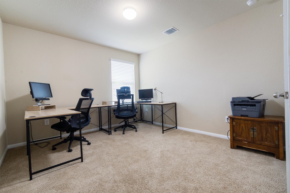 11620 Carbrook Road Manor, TX 78653 - Photo 23 of 40 a view of a workspace with furniture