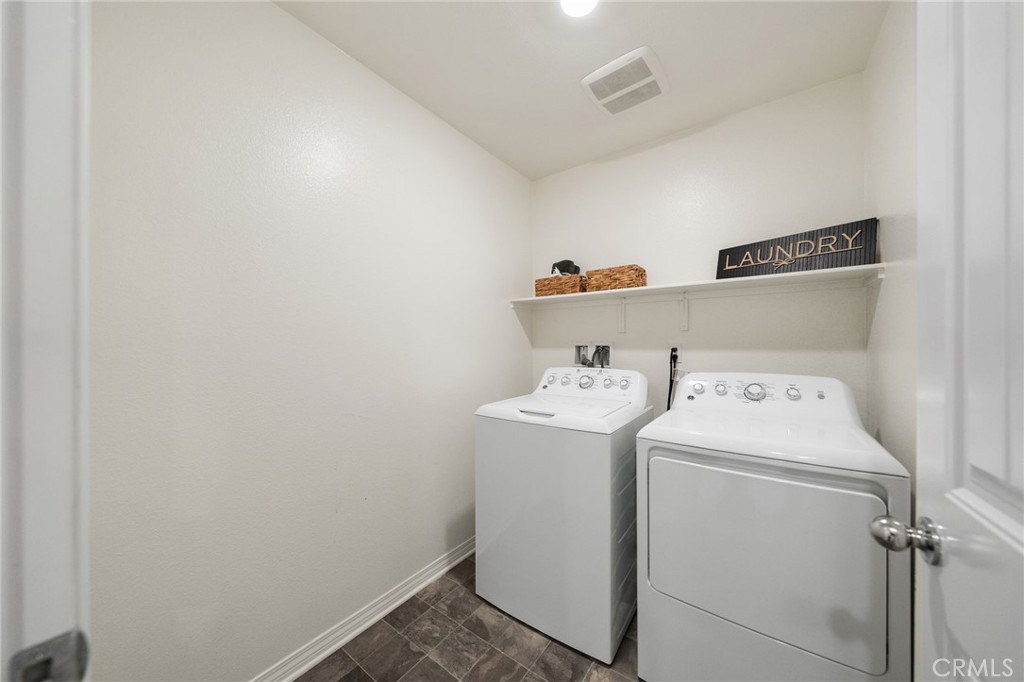 41979 Rondo Street, Unit 1106 Murrieta, CA 92562 - Photo 13 of 18 a utility room with dryer and washer