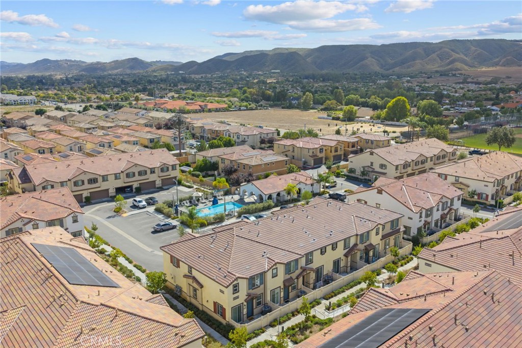 41979 Rondo Street, Unit 1106 Murrieta, CA 92562 - Photo 16 of 18 an aerial view of a house with a mountain