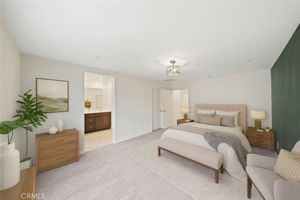 41979 Rondo Street, Unit 1106 Murrieta, CA 92562 - Photo 2 of 18 a spacious bedroom with a bed and a couch