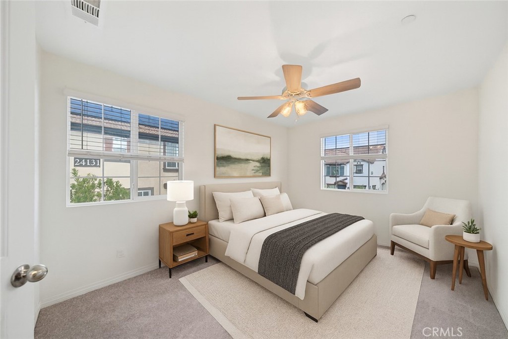 41979 Rondo Street, Unit 1106 Murrieta, CA 92562 - Photo 3 of 18 a bedroom with a bed and a large window