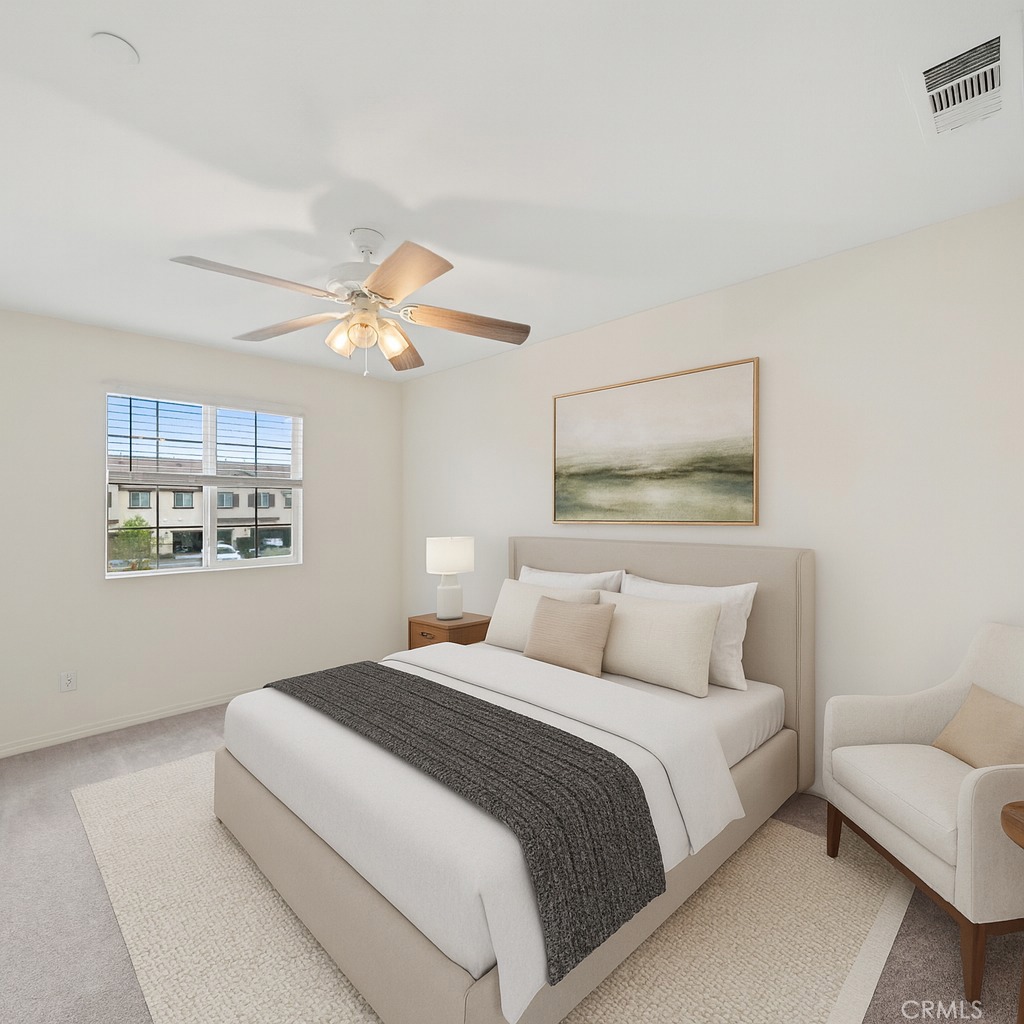 41979 Rondo Street, Unit 1106 Murrieta, CA 92562 - Photo 4 of 18 a bedroom with a bed and a large mirror