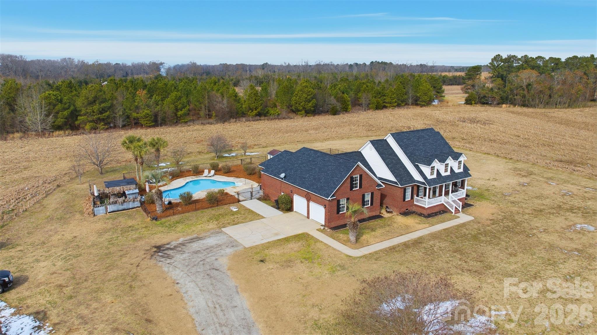 a view of a swimming pool with a yard
