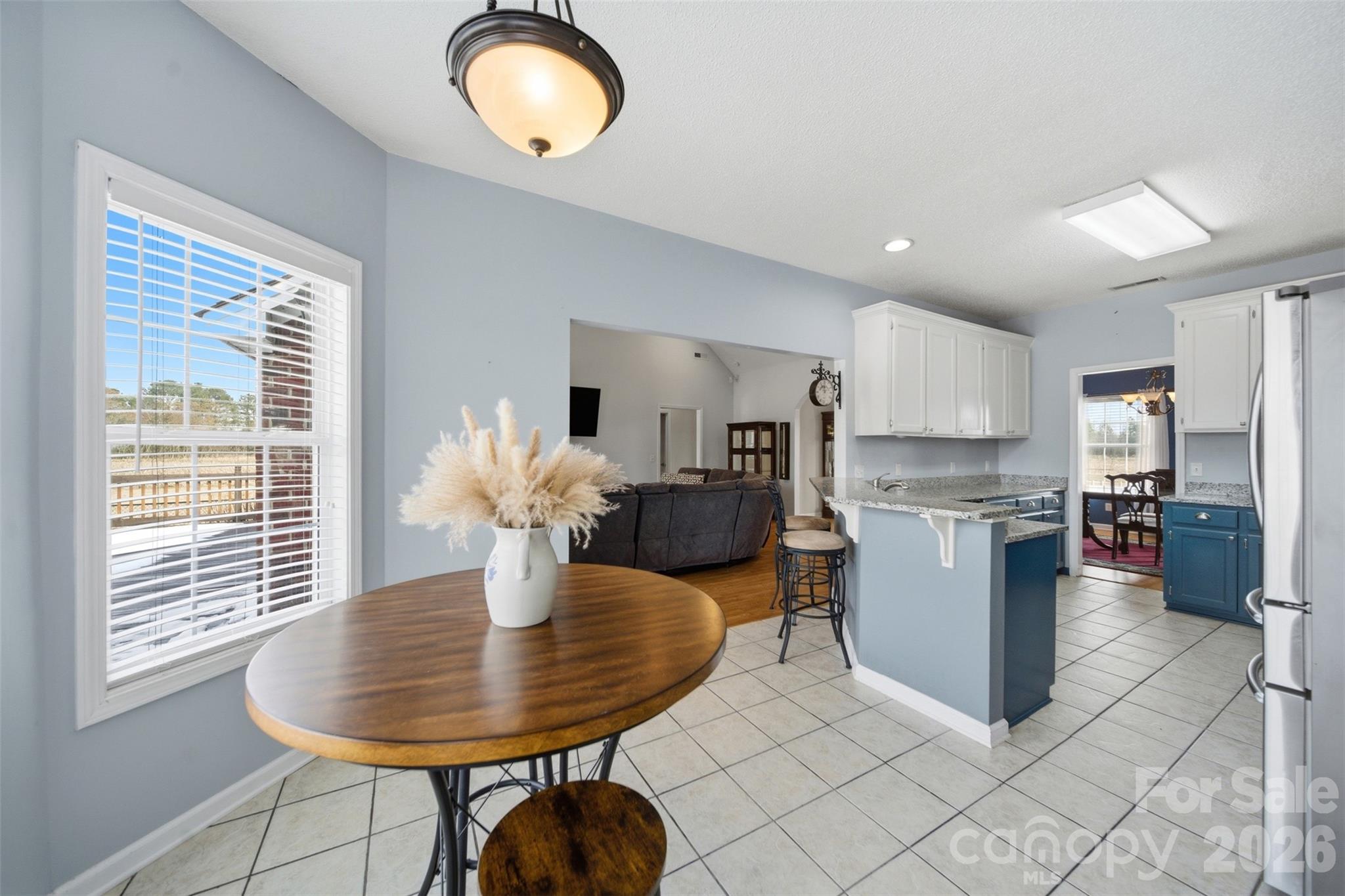2535 Citrus Lane Sumter, SC 29153 - Photo 11 of 47 a kitchen with sink refrigerator dining table and chairs