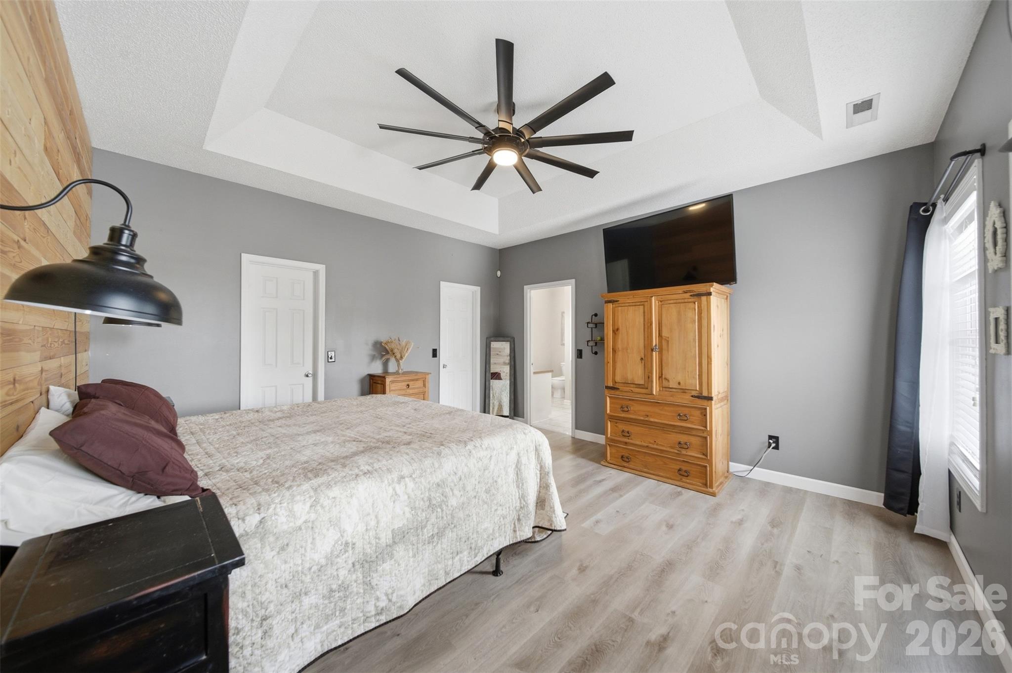 2535 Citrus Lane Sumter, SC 29153 - Photo 19 of 47 a bedroom with a bed and a chandelier