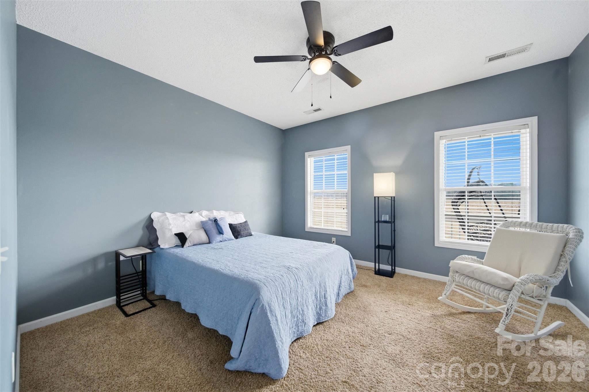 2535 Citrus Lane Sumter, SC 29153 - Photo 24 of 47 a bedroom with a bed a chair and a large window